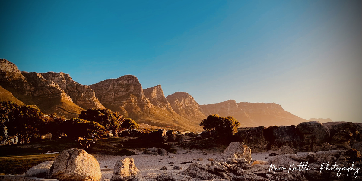 Golden hour light over the Twelve Apostles mountain range, Cape Town